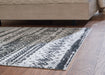 Devman 5'2" x 6'10" Rug Rug Ashley Furniture