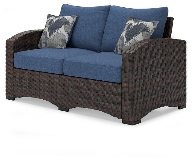 Windglow Outdoor Loveseat with Cushion Outdoor Seating Ashley Furniture