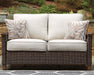 Paradise Trail Loveseat with Cushion Outdoor Seating Ashley Furniture