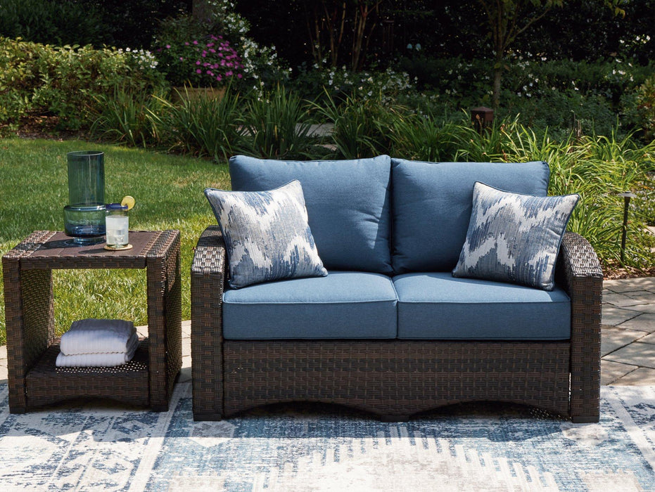 Windglow Outdoor Loveseat with Cushion Outdoor Seating Ashley Furniture