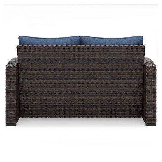 Windglow Outdoor Loveseat with Cushion Outdoor Seating Ashley Furniture