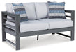 Amora Outdoor Loveseat with Cushion Outdoor Seating Ashley Furniture