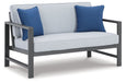 Fynnegan Outdoor Loveseat with Table (Set of 2) Outdoor Seating Set Ashley Furniture