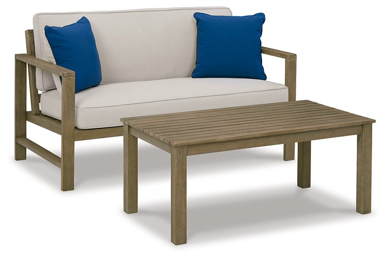 Fynnegan Outdoor Loveseat with Table (Set of 2) Outdoor Seating Set Ashley Furniture