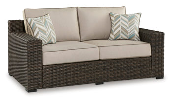 Coastline Bay Outdoor Loveseat with Cushion Outdoor Seating Ashley Furniture