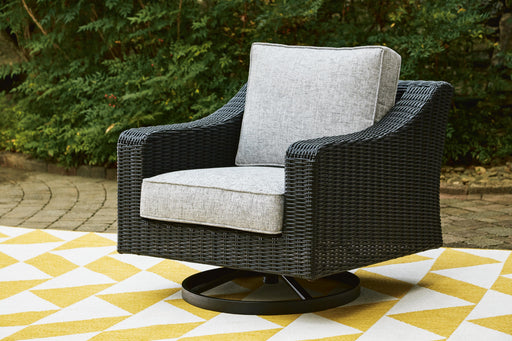 Beachcroft Outdoor Swivel Lounge with Cushion - Dayton Discount Furniture